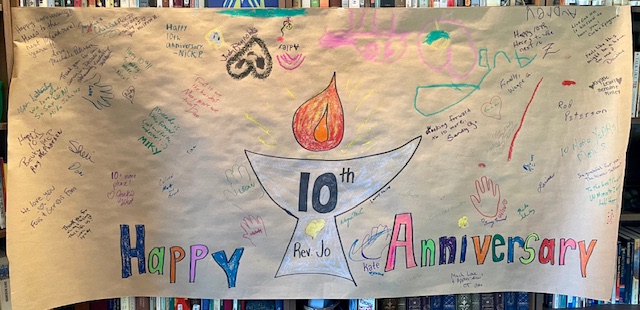 Photo of banner scrawled with kind words wishing Rev Jo a happy anniversary