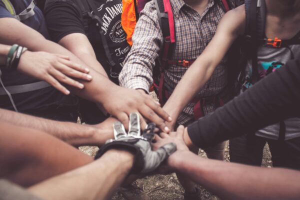 hands joined together in community